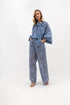 Loose lace trousers with pockets and elastic waist